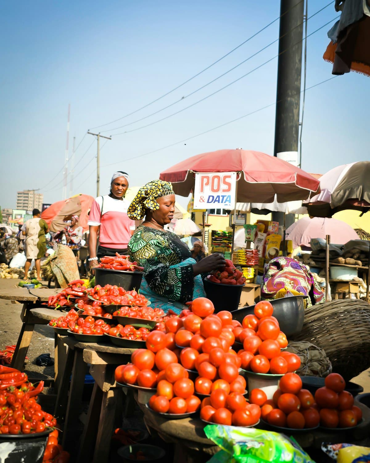 Vendors at a bustling Nigerian marketplace